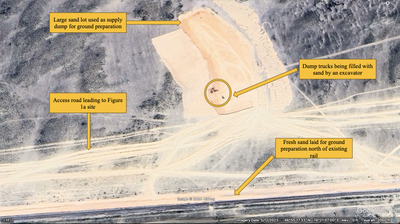 Google Earth imagery from May 12, 2023, showing a forward sandlot along the construction site, dump truck and excavators, and the access road. Coordinates 46°55'27.46